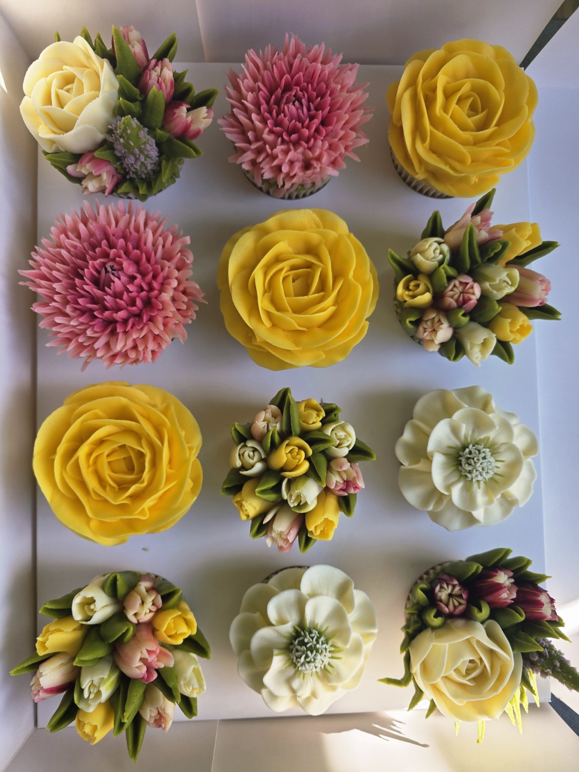 Box of 12 hand-piped floral cupcakes